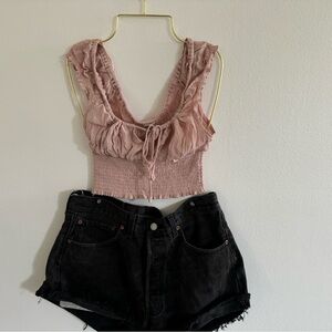 Pink top and black Levi shorts